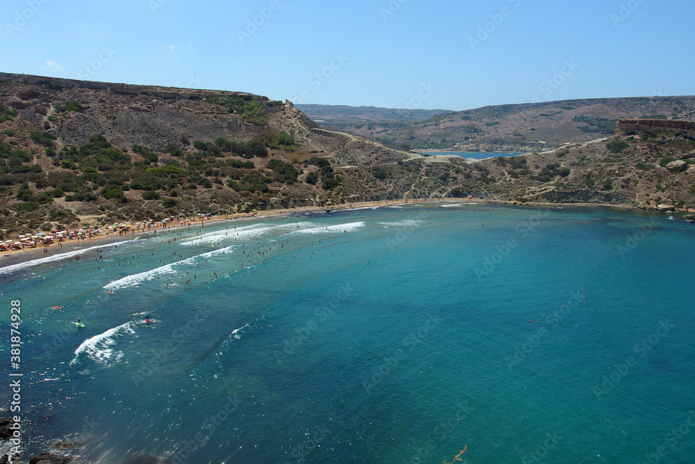 beautiful sandy beach on Malta island with clear blue sea