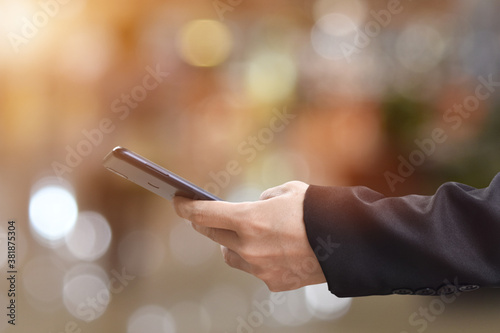 Close-up image of male hands using mobile smartphone. Business technology and social networks concept