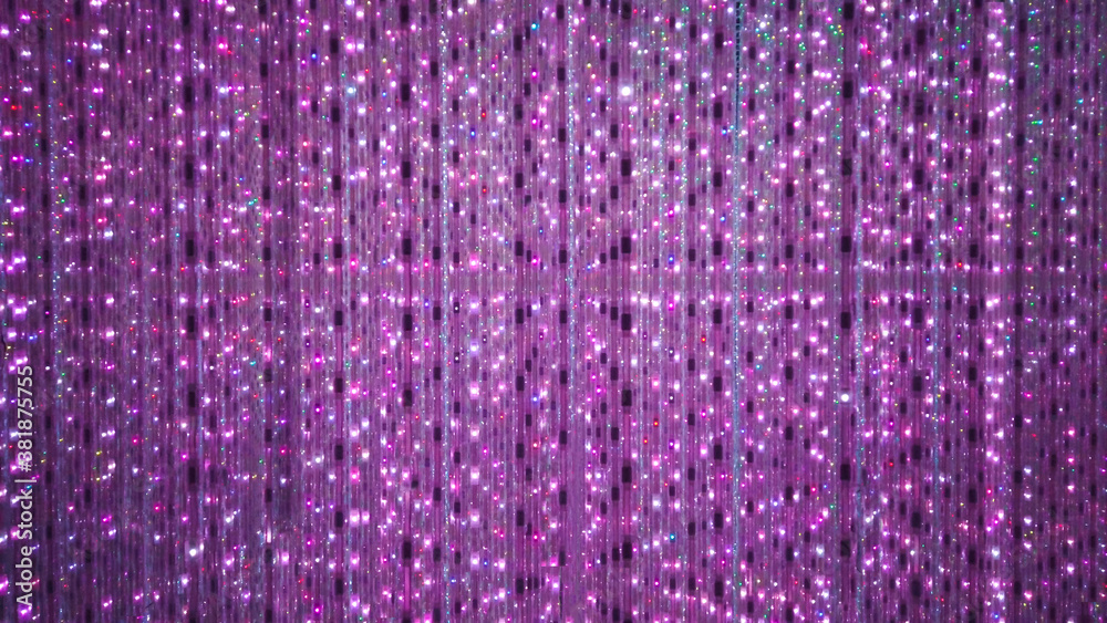 Purple stage background of LED flashing and flickering bulbs.