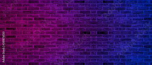 Lighting effect neon light on brick wall texture for party or club bar background decoration.