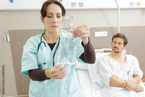 a nurse preparing saline intravenous