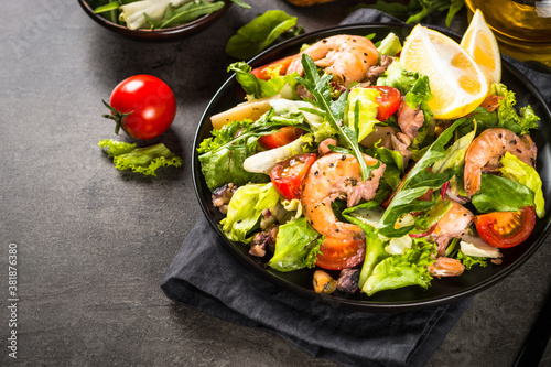 Seafood salad with leaves and vegetables.