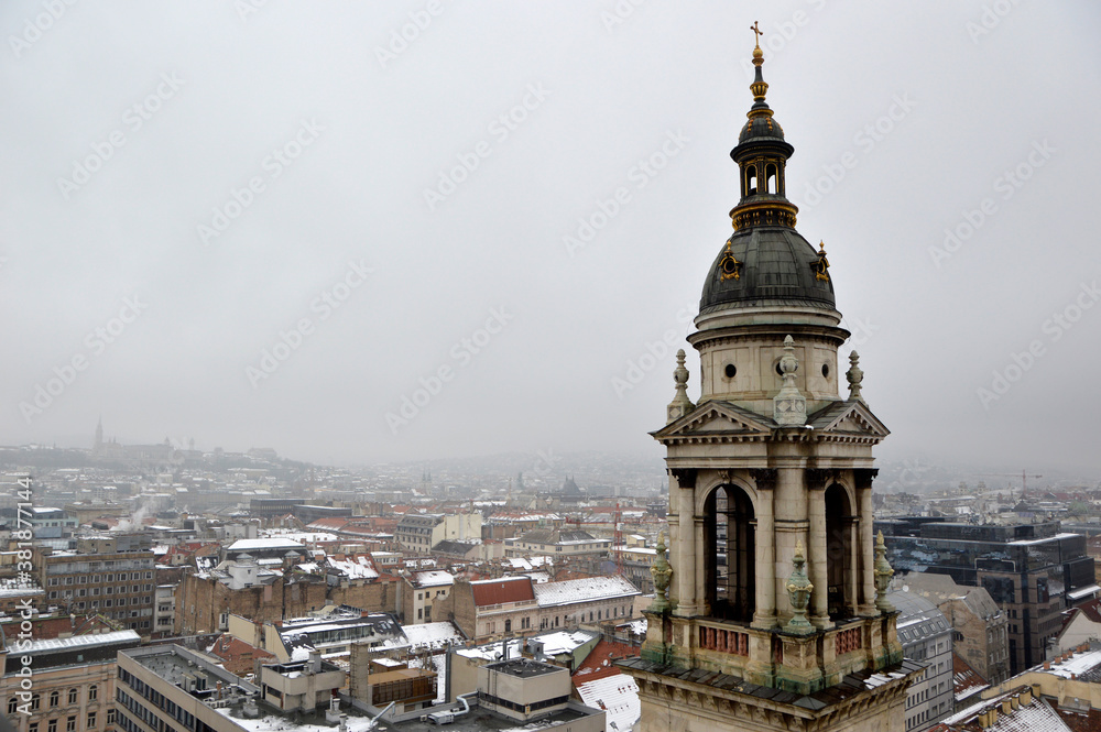 panoramic view of Budapest seen from the top of the tower of Saint Istvan church in foggy winter day