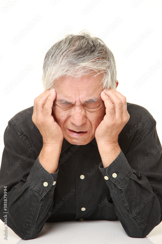 senior Japanese man suffers from headache senior Japanese man suffers from headache