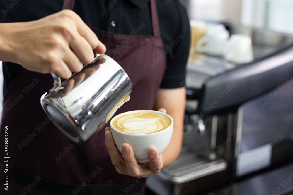 Close-up of Man Barista making latte art