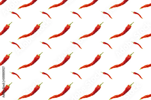 Seamless pattern of dried red chili peppers or cayenne chili peppers isolated on white background.