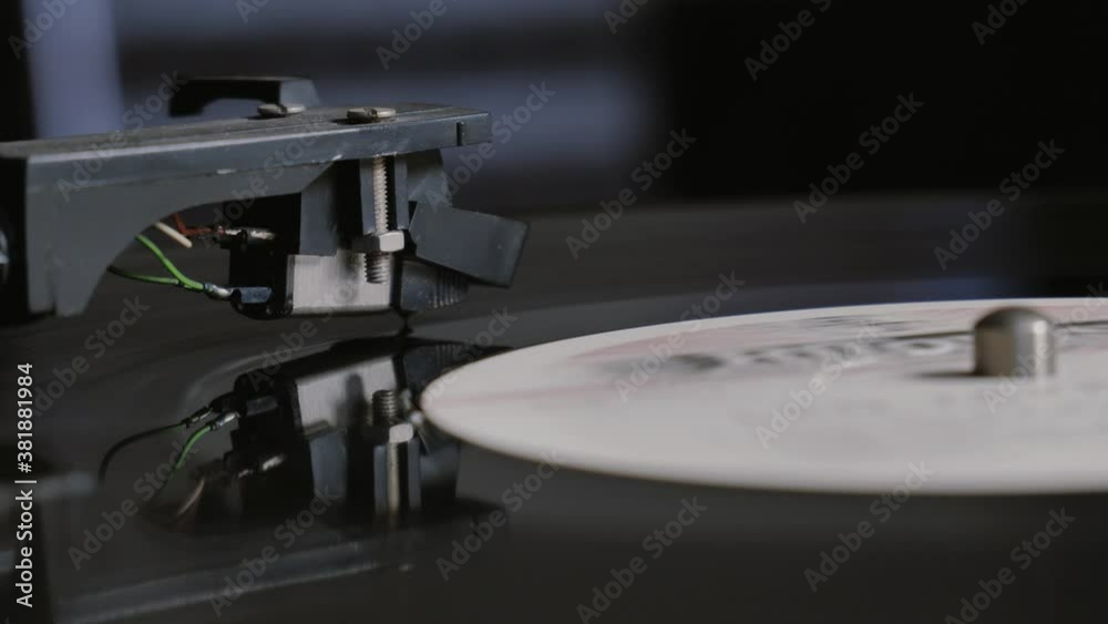 Cinemagraph vinyl record is spinning. Old retro turntable.turntable stylus on a record Cinemagraph vinyl record is spinning. Old retro turntable.turntable stylus on a record