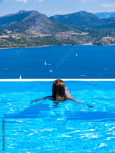 Woman at the infinity swimming pool