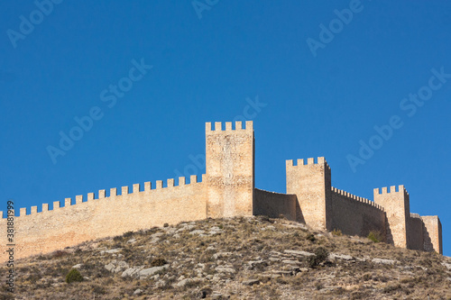 Castle and wall. Albarrac  n is a very famous town for being one of the most beautiful in Aragon  Spain. It is famous for its medieval castle