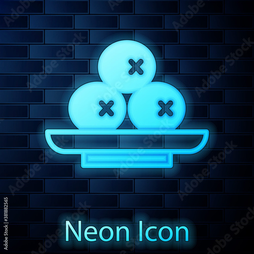 Glowing neon Olives on plate icon isolated on brick wall background. Vector.