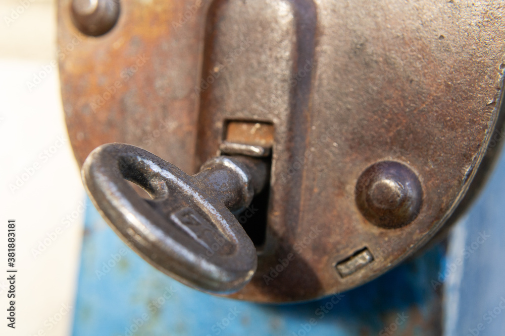 an old padlock with a key inside.