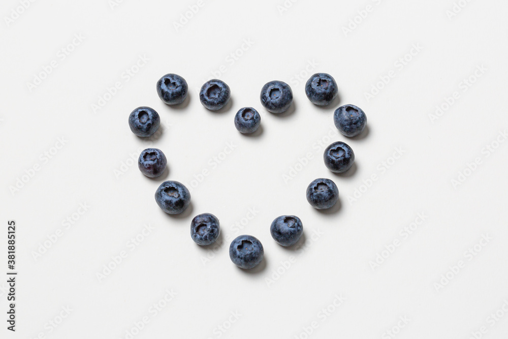 blueberries in a heart shape on white background, heartshaped fruit blueberries in a heart shape on white background, heartshaped fruit