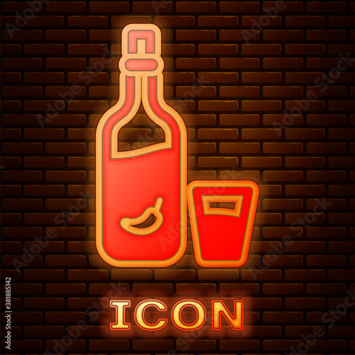 Glowing neon Vodka with pepper and glass icon isolated on brick wall background. Ukrainian national alcohol. Vector.