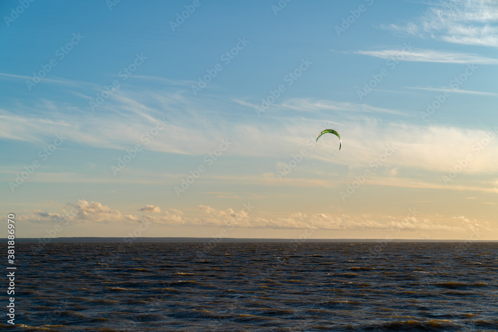 Beautiful sunset sky on the beach. Kitesurfing. Power kite. Beautiful scenery Beautiful sunset sky on the beach. Kitesurfing. Power kite. Beautiful scenery