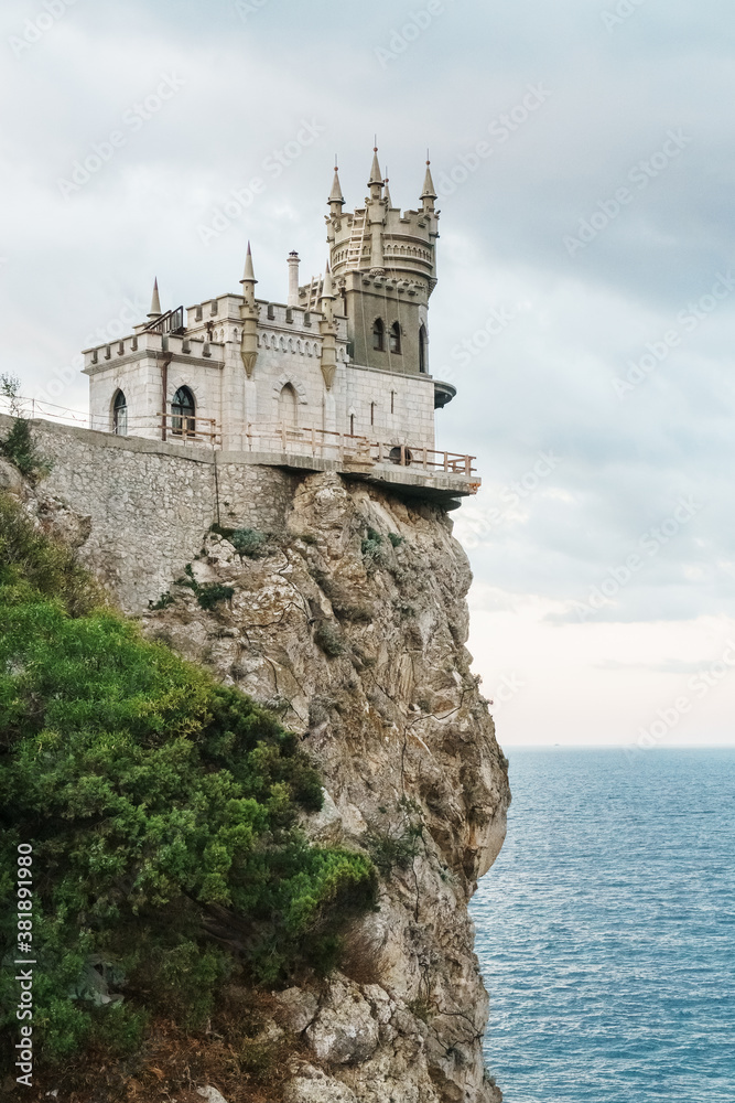 Castle swallow's nest, stands on a rock at the cliff on the background of the black sea.