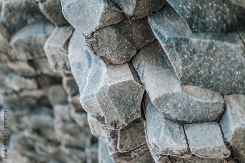 Natural stone texture. Basalt lava formations like columns. Icelandic typical natural background. Volcanic Basalt Coloumn Formations in Iceland. photo