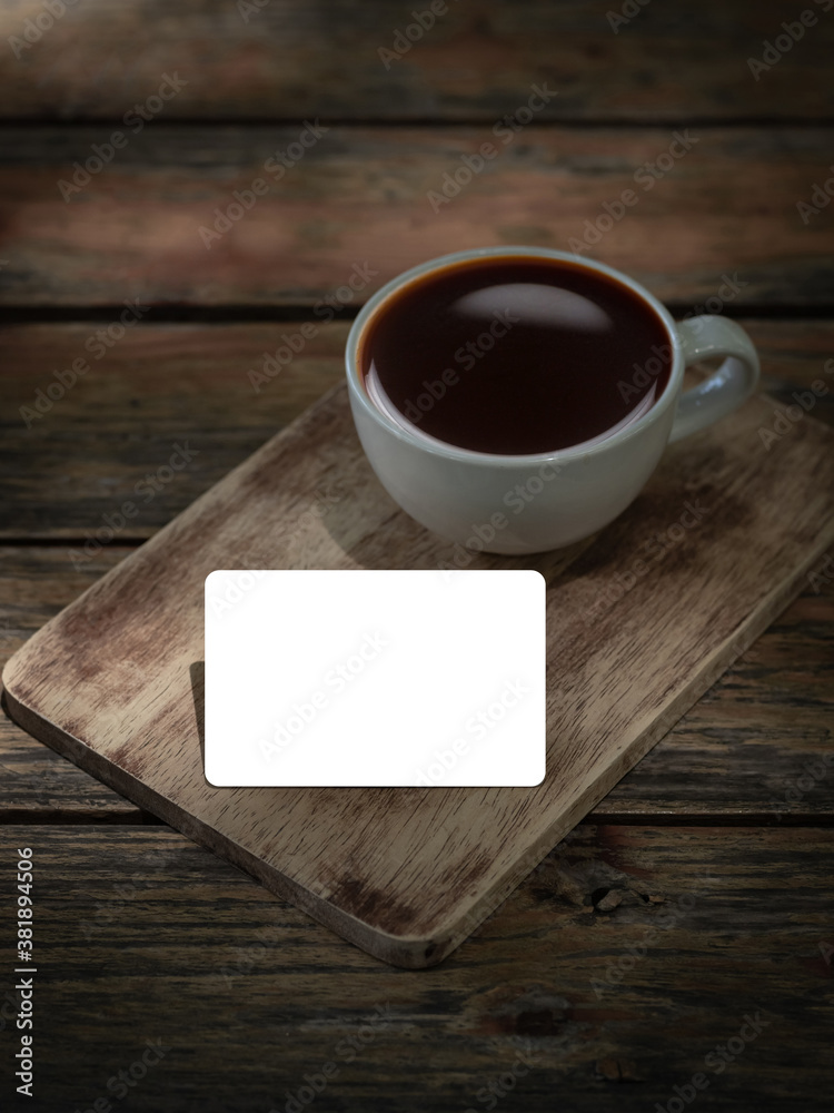 Blank credit card with a cup of coffee on wood table Blank credit card with a cup of coffee on wood table