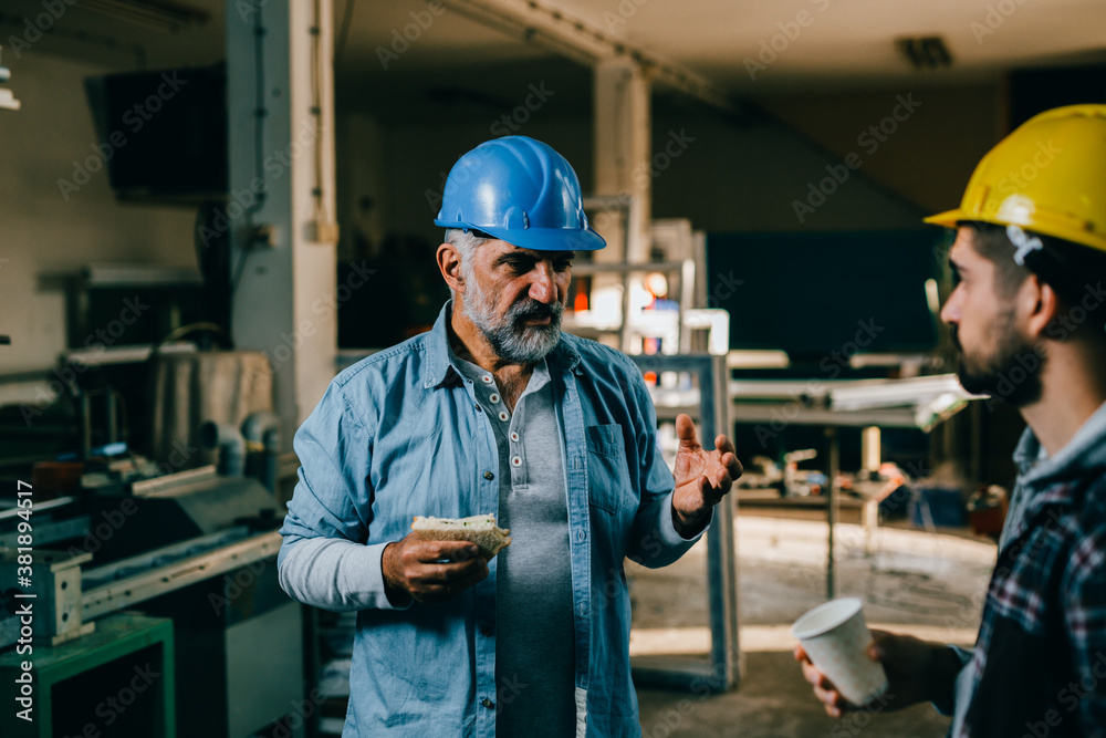 industrial workers having lunch break industrial workers having lunch break