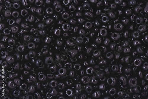 Black Beads on the white background. Background or texture of beads. Close up, macro,It is used in finishing fashion clothes. make bead necklace or string of beads for woman of fashion.