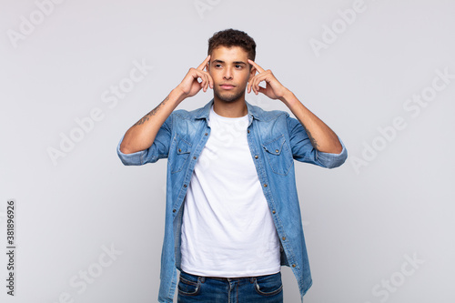  feeling confused or doubting, concentrating on an idea, thinking hard, looking to copy space on side