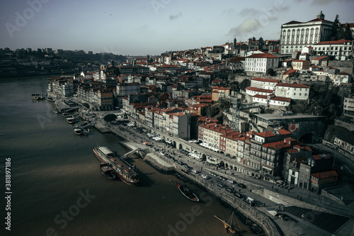 aerial view on Porto red roofs from the bridge through Douro river