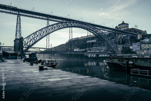View on Douro river and the Dom Luís I Bridge from seafront at misty early morning © Woodenmen