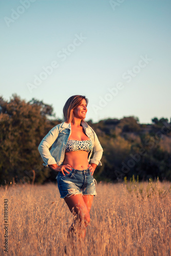Woman on bikini top on the countryside
