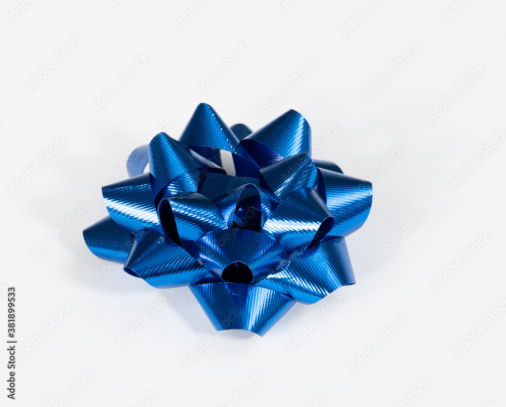 Shiny, festive blue bow for special occasion, on white background Shiny, festive blue bow for special occasion, on white background