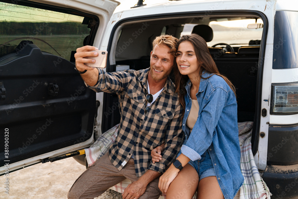 Young couple in love making selfie using smart phone Young couple in love making selfie using smart phone