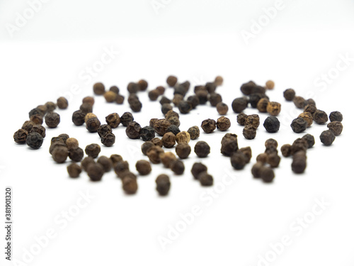 Black pepper background, herbs, spices in front view.