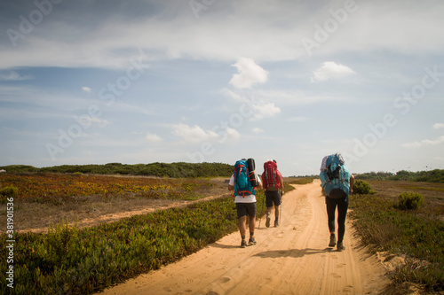 Hikers on a dusty road
