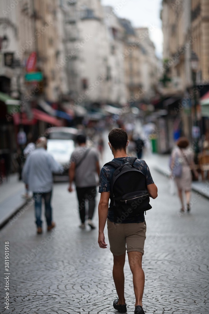 Fototapeta premium People on the street in the center of Paris. Blurred background.