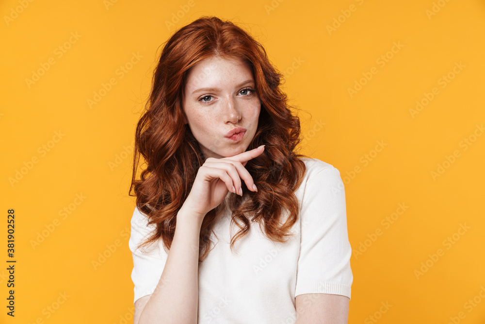 Image of ginger serious girl thinking and looking at camera Image of ginger serious girl thinking and looking at camera