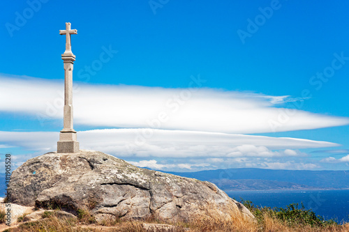 Cross at Cabo de Finisterre, Galicia, Spain, marking the end of the Camino de Santiago (the Way of St. James) photo