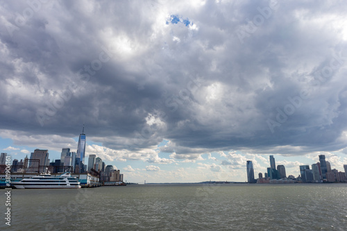 Hudson River between the Lower Manhattan Skyline and Jersey City with a Beautiful Cloud Filled Sky