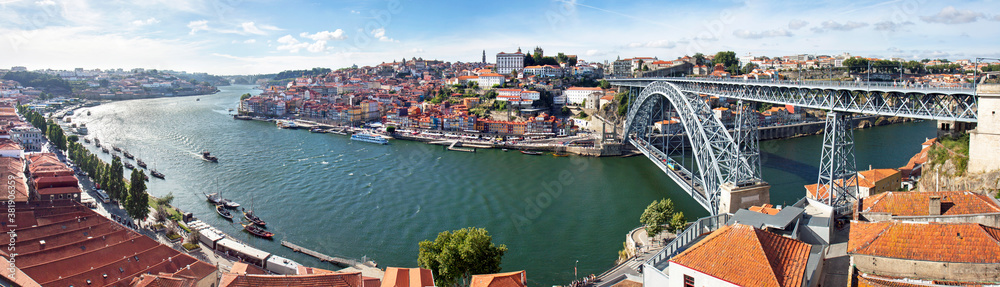 High view on the Dom Luis I bridge from Vila Nova da Gaia, looking at the old town of Porto and the Douro river.