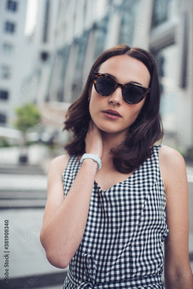 Elegant sensual adult woman in sunglasses in downtown Elegant sensual adult woman in sunglasses in downtown