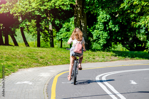 Cyclist ride on the bike path in the city Park 