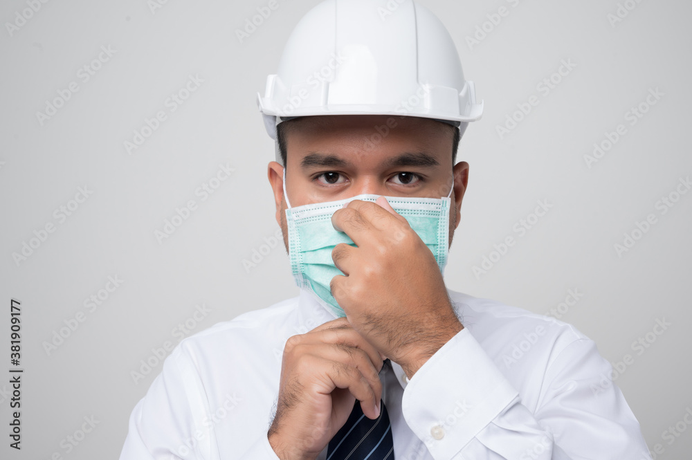 Young asian manager civil engineer helmet hard hat wearing protection mask safety from virus and pollution on isolated white background.. Young asian manager civil engineer helmet hard hat wearing protection mask safety from virus and pollution on isolated white background..