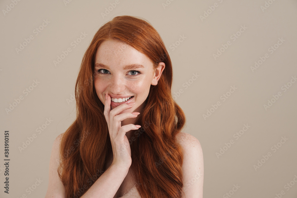 Photo of happy redhead shirtless girl smiling and looking at camera Photo of happy redhead shirtless girl smiling and looking at camera