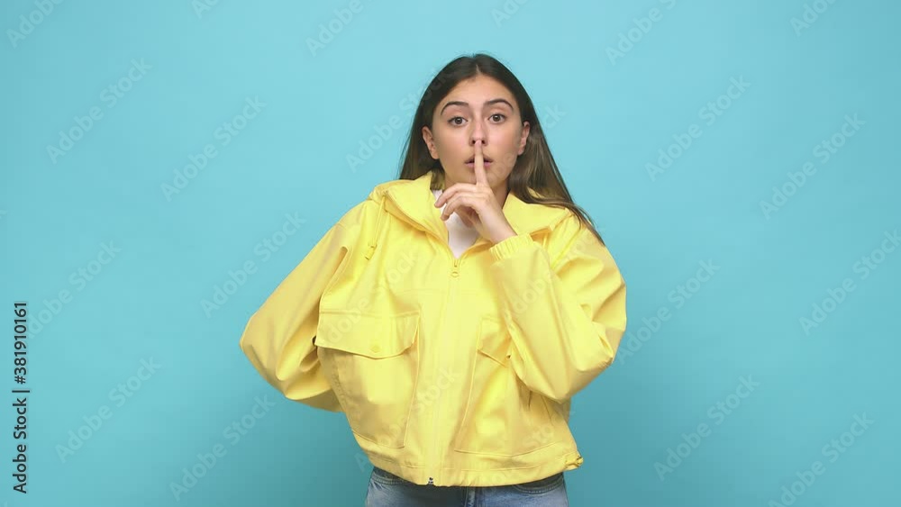 Young caucasian woman keeping a secret or asking for silence Young caucasian woman keeping a secret or asking for silence