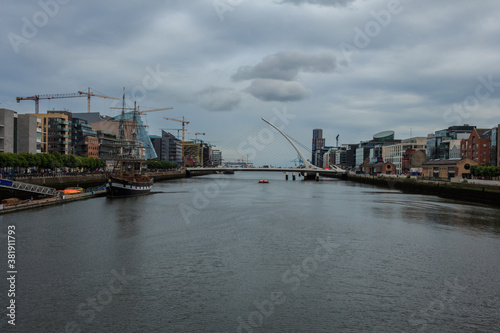 View of bridge over River Liffey in Dublin on a cloudy day © Brian