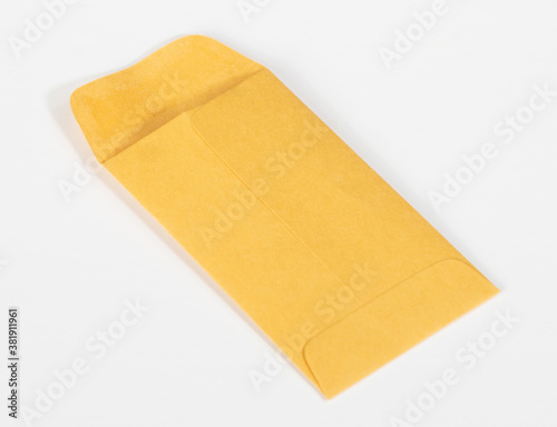 Small manila envelope with open flap on white background