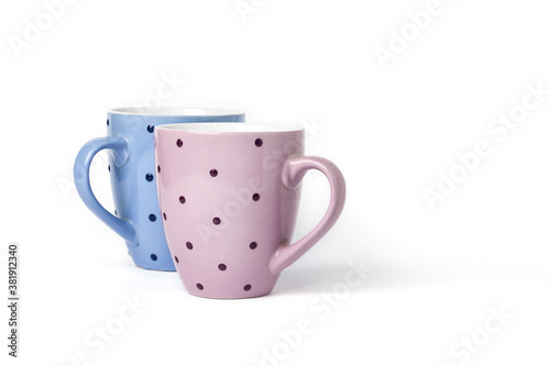 Two colorful tea cups isolated on white background