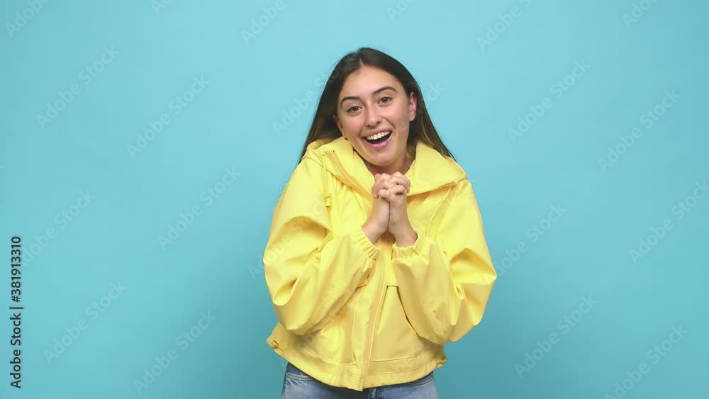 Young caucasian woman praying for luck, amazed and opening mouth looking to front Young caucasian woman praying for luck, amazed and opening mouth looking to front