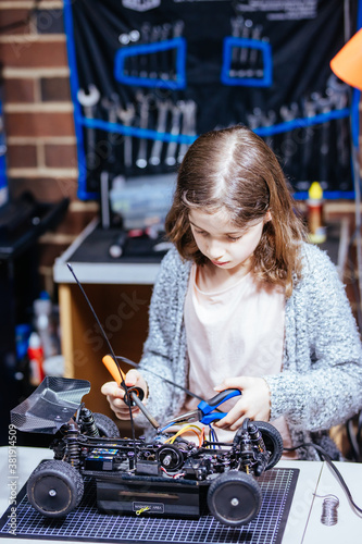 Young Female Child Soldering New Motor Leads