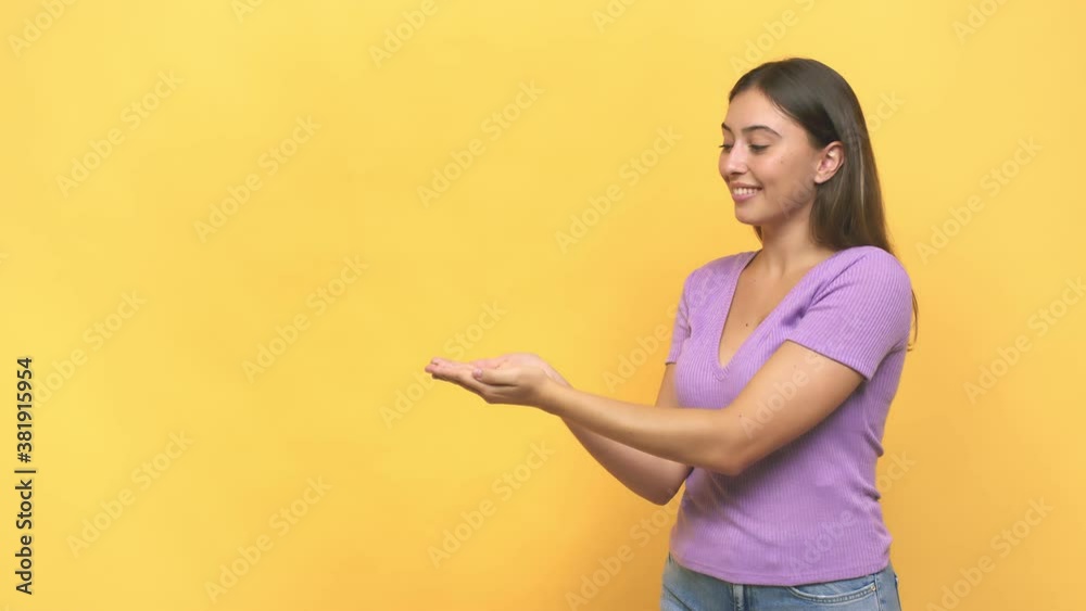 Young caucasian woman holding a copy space on a palm Young caucasian woman holding a copy space on a palm