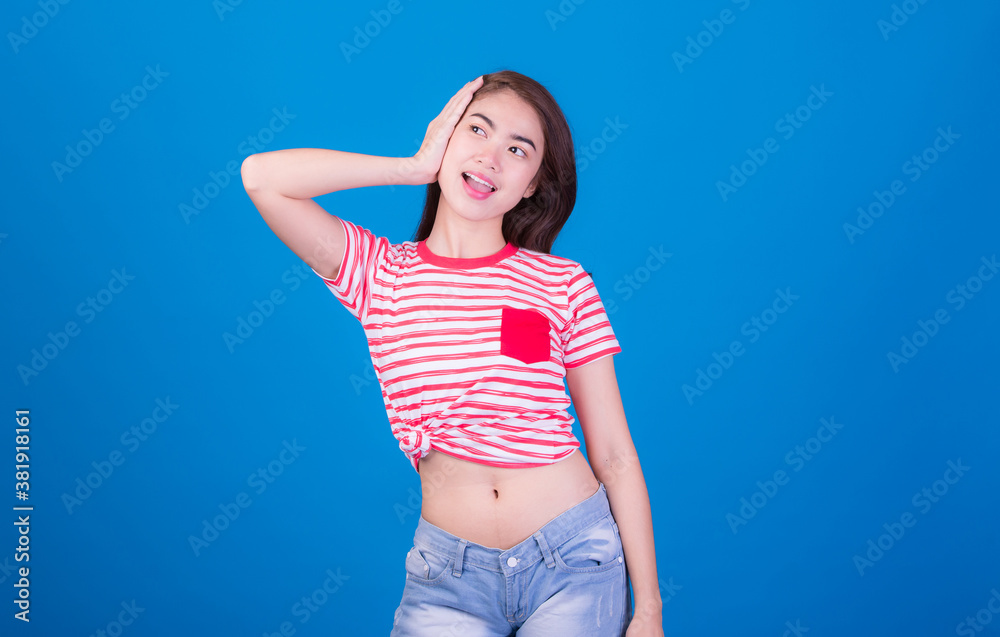 Portrait of beautiful asia young woman, on blue color background with copy space. Human face expressions, emotions feelings, body language,beauty and fashion concept. Portrait of beautiful asia young woman, on blue color background with copy space. Human face expressions, emotions feelings, body language,beauty and fashion concept.
