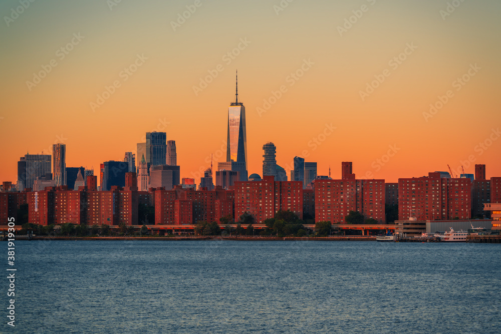 city skyline at sunset sunrise New York buildings beautiful sky colors orange 