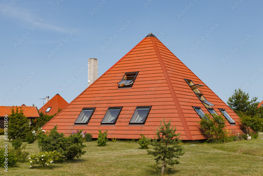 House build as pyramid. Tiled roof. Oriental approach used in Europe. House build as pyramid. Tiled roof. Oriental approach used in Europe.